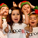 School children performing at a show for danceaid