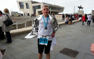 Neil after completing the Liverpool Marathon 2012