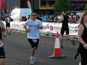 A danceaid supporter running in the Virgin London Triathlon