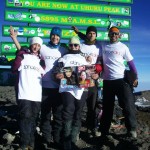 Team of danceaid supporters at the top of Mount Kilimanjaro