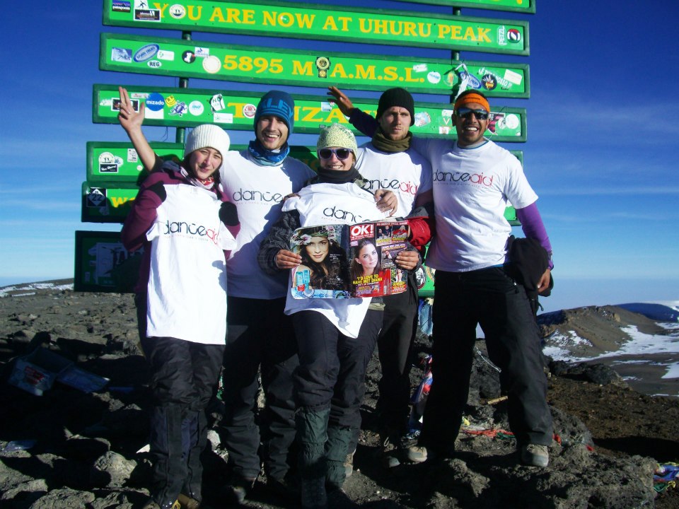 Team of danceaid supporters at the top of Mount Kilimanjaro