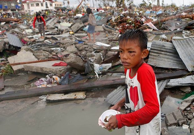 Boy begs in aftermath of Typhoon Haiyan